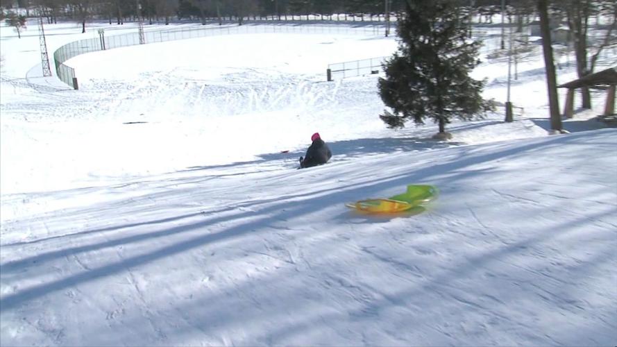 Sledders enjoy snow in Faurot Park 2.jpg