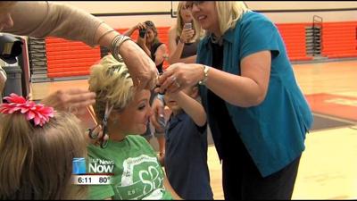 Pre-school teacher shaves head for children's cancer charity