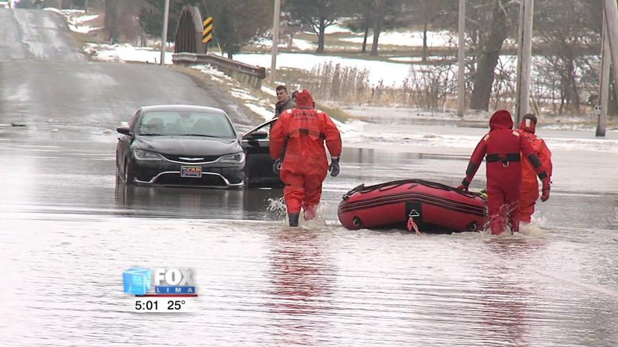 Two people rescued after driving vehicle into flooded roadway 2.jpg
