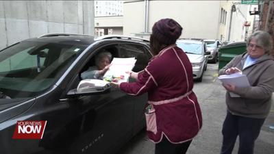 ArtsSpace/Lima handing out art bags for Thanksgiving arts and crafts