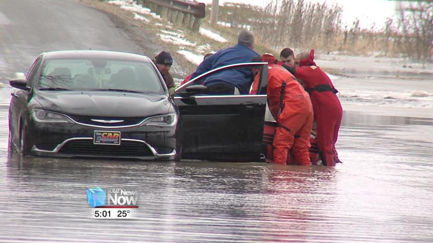 Two people rescued after driving vehicle into flooded roadway 1.jpg