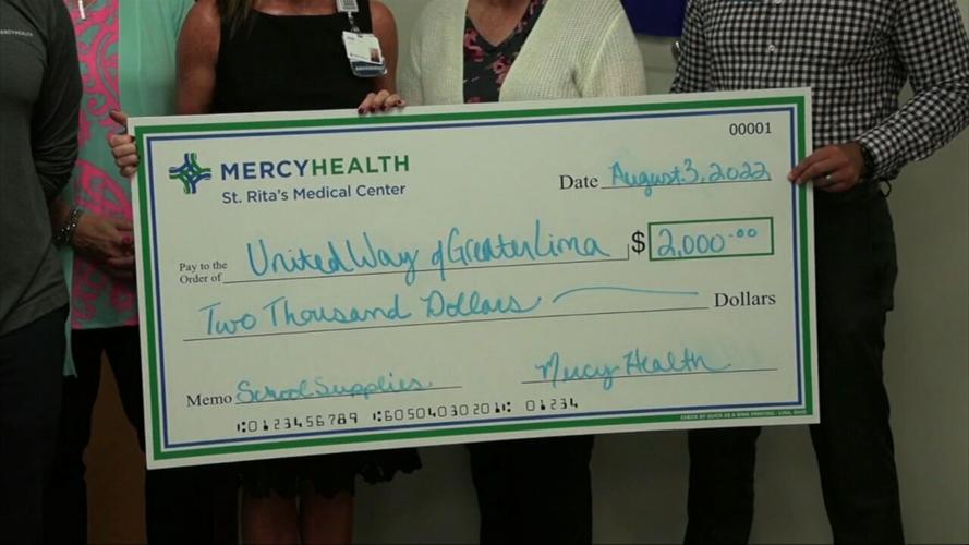 Mercy Health donates check to the United Way to assist with the purchase of school supplies