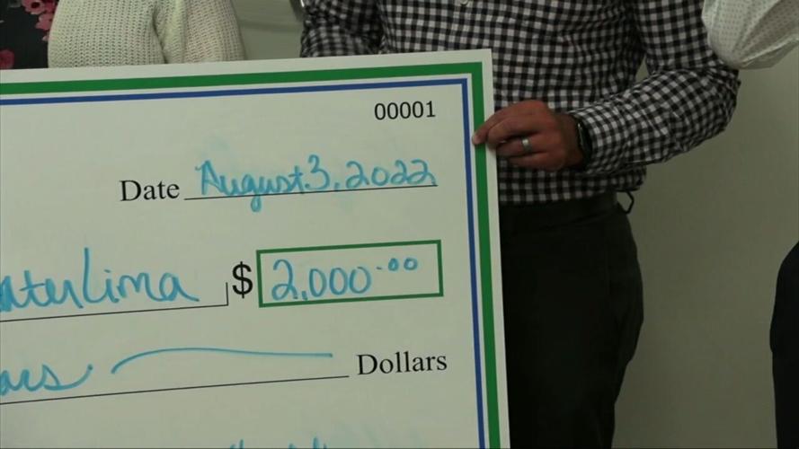 Mercy Health donates check to the United Way to assist with the purchase of school supplies