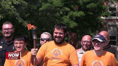 ‘Flame of Hope’ passes through Findlay for Special Olympics Torch Run