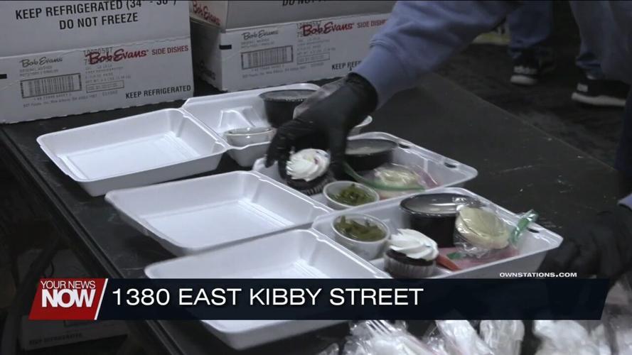 Volunteers and West Ohio Food Bank staff prepare Christmas Eve ham dinners