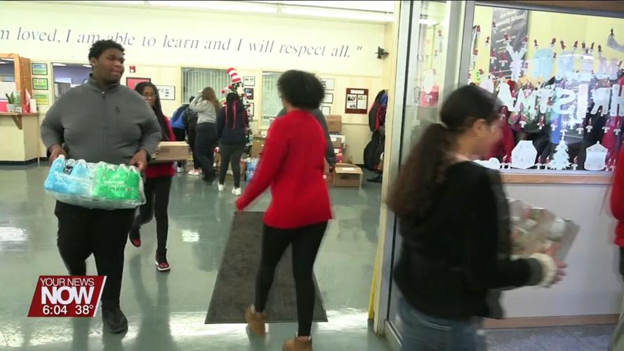 Heir Force Community School students making a positive impact in the community with food drive donation