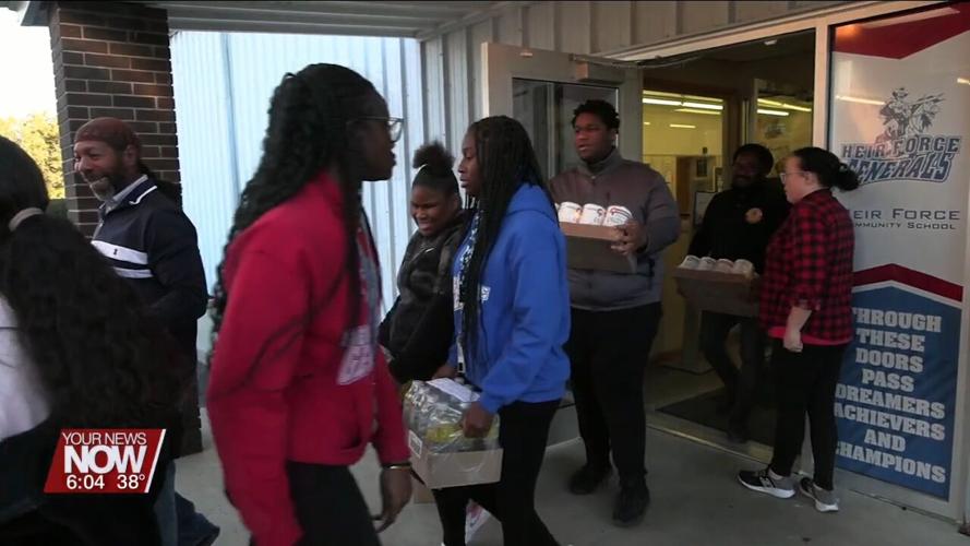 Heir Force Community School students making a positive impact in the community with food drive donation
