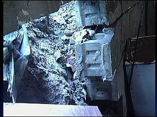 Basement walls collapse under flood waters