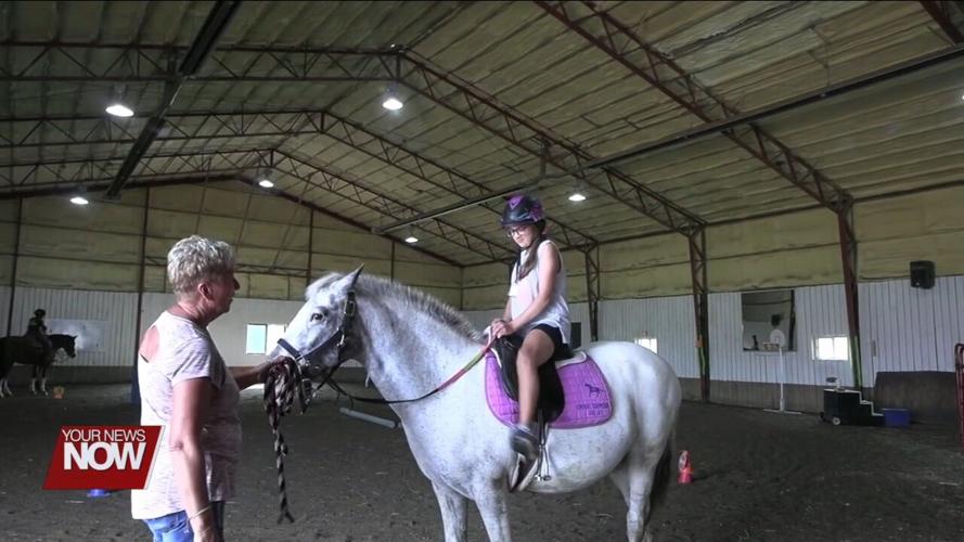 Horses and volunteers at Challenged Champions provide hope and smiles to those in need