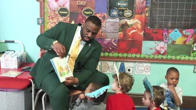 Lima Officials, Student-Athletes Promote Literacy at Local Child Care Center