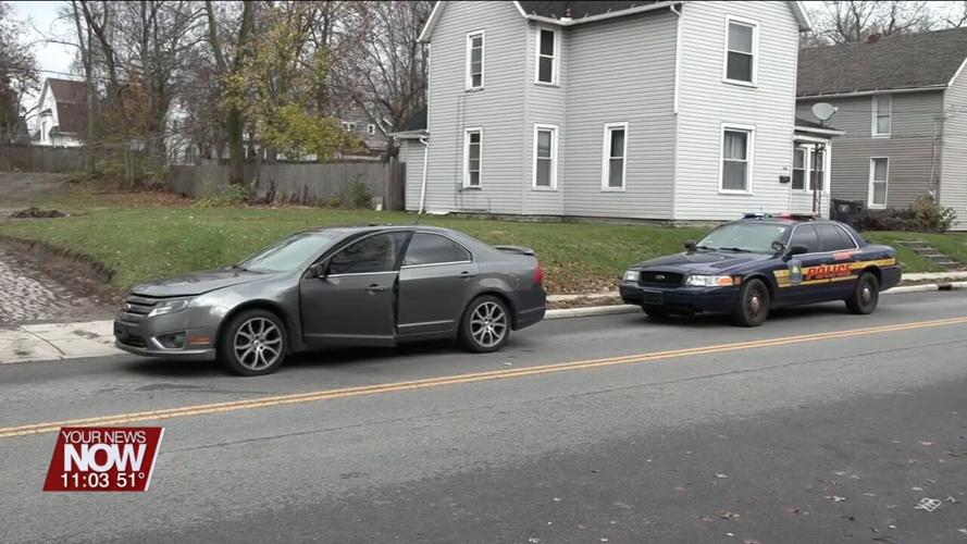Lima city councilman Derry Glenn distributing cards about how to act when pulled over by police