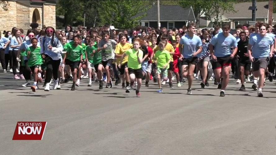 Lima Catholic School students finish Positive Addiction Week with a message from certified life coach Julie Wilkes and the annual 5K