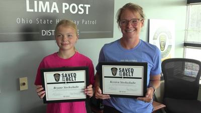 Brynne and Kristen Stechschulte receive “Saved by the Belt” award following January car crash