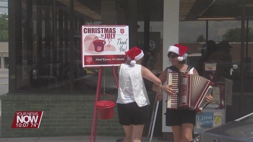 Forget "bell ringing"--this duo put on a show for the Salvation Army's Christmas in July