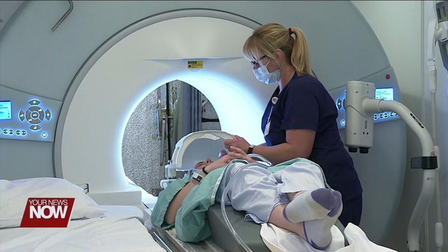 A mother discusses her journey of having a large brain aneurysm removed while pregnant