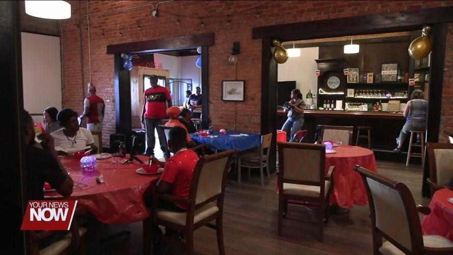 Lima residents taste test culture at celebration of Haitian Flag Day