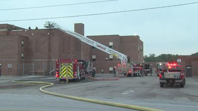 Firefighters looking into the cause of a roof fire at Shawnee Middle School