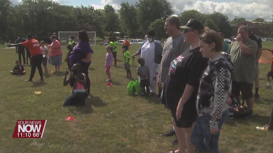 Local non-profit athletic organization gives away 200 soccer balls