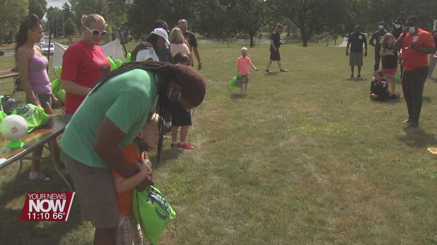Local non-profit athletic organization gives away 200 soccer balls