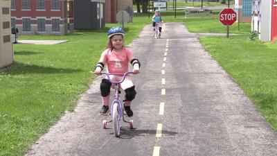 Kids learn bicycle safety skills during Bike Rodeo at Lima’s Safety City