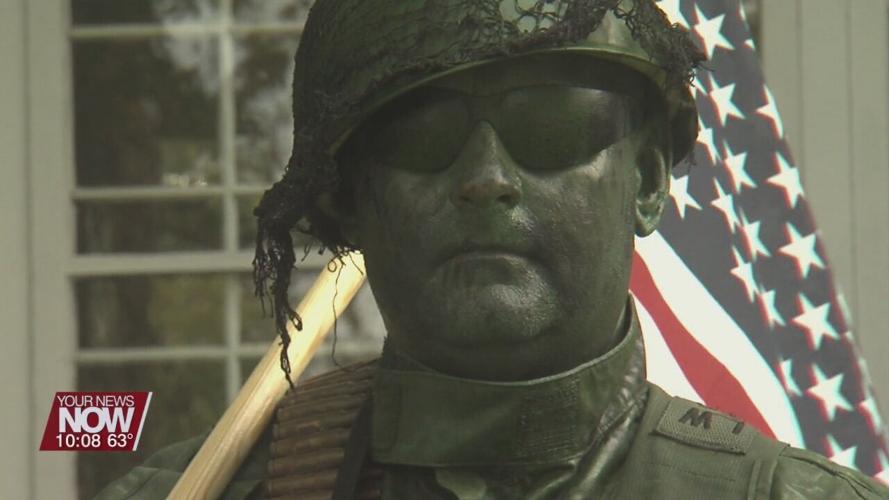 Local man poses as a live statue