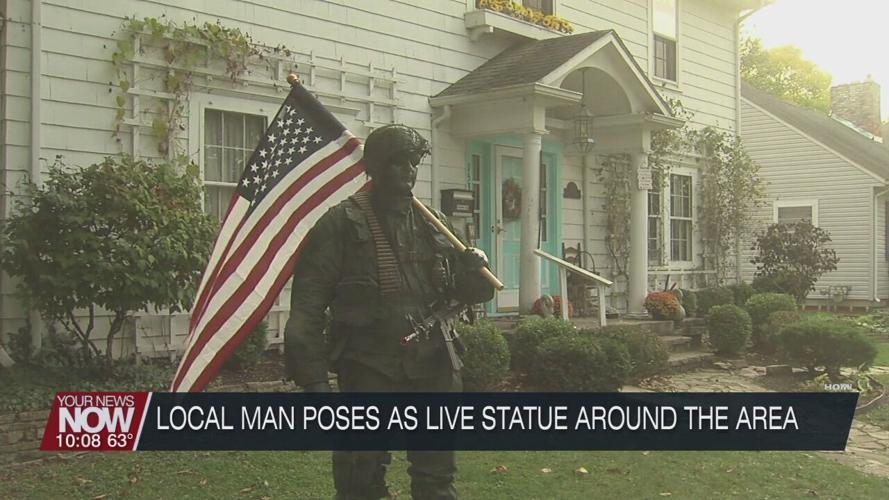 Local man poses as a live statue