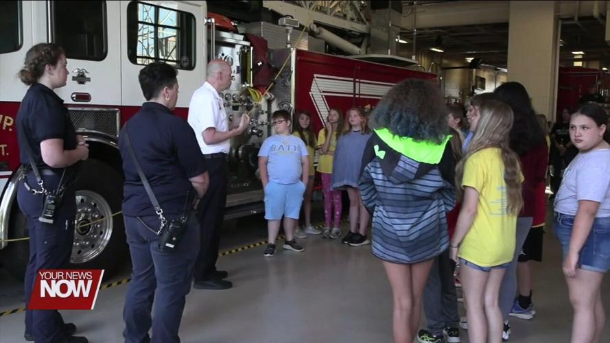 Bath Elementary 5th graders celebrate the completion of their D.A.R.E. program with Bath Township firefighters