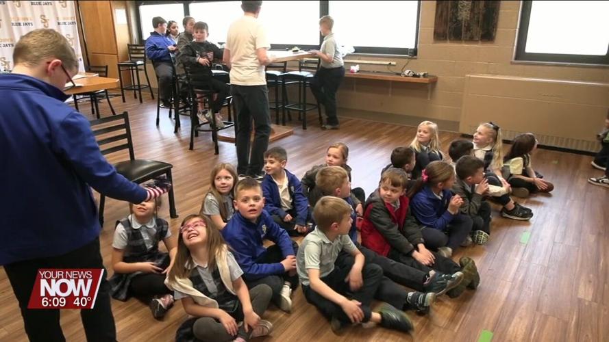 6th graders at Delphos St. John's teach kindergarteners Bible stories with puppets