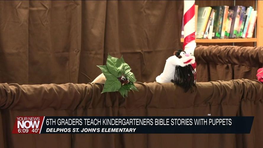 6th graders at Delphos St. John's teach kindergarteners Bible stories with puppets