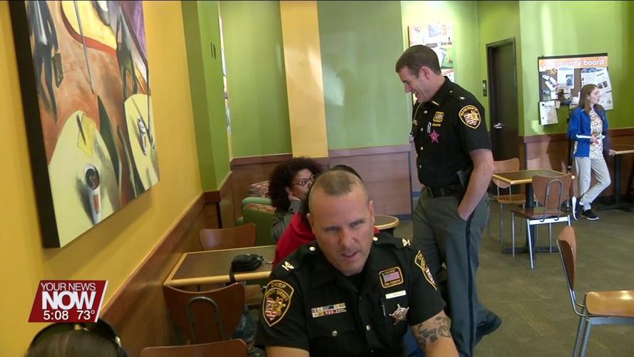 Law enforcement from Allen County meets community members for National Coffee with a Cop Day
