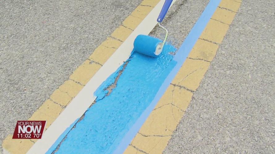 Wapakoneta Breakfast Optimist Club paints blue line to honor law enforcement