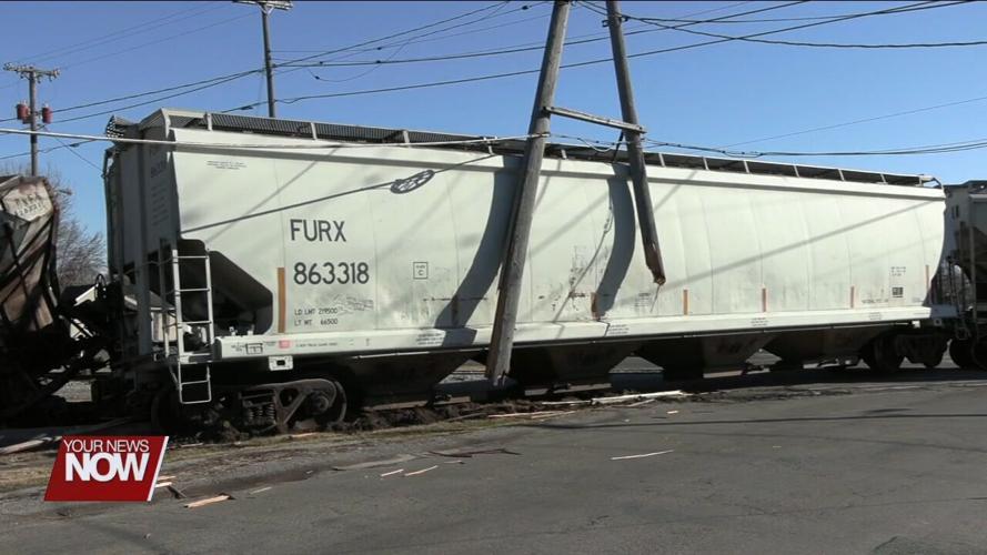Train derails in Delphos taking out power poles along the tracks