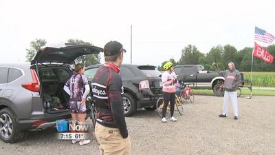 Bicyclists spell out "Cursive Ohio"