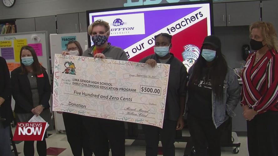 Two teens in foster care make a donation to Early Childhood Program at Lima City Schools