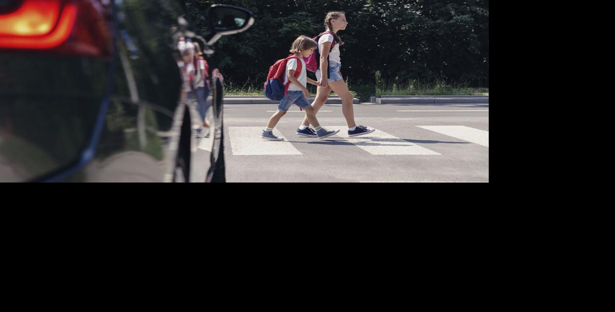 Children next to a car walking Generic