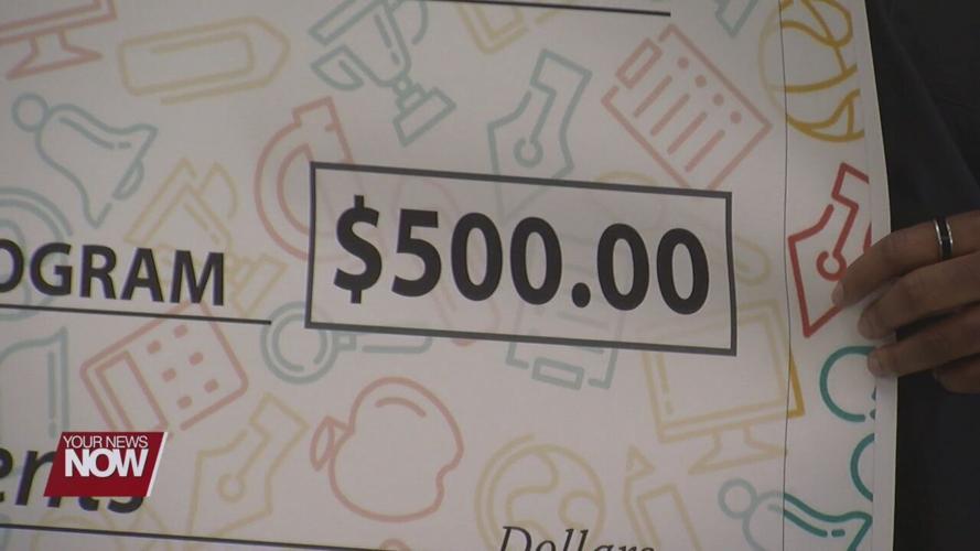 Two teens in foster care make a donation to Early Childhood Program at Lima City Schools