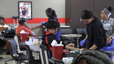 Apollo students practice Phlebotomy skills on friends and family