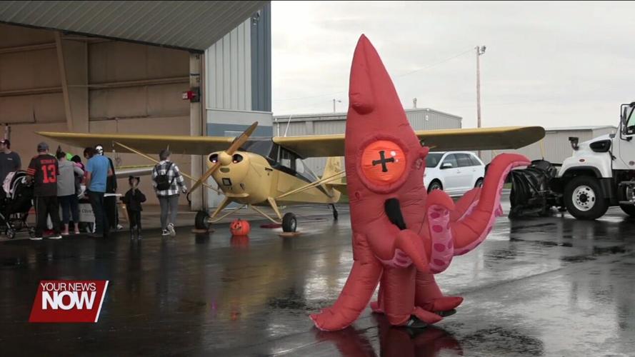 Families get to experience spooky fun and airplanes during Trick-or-Treat at the Scareport event