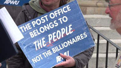 Local branch of American Postal Workers Union holds rally against worker cuts