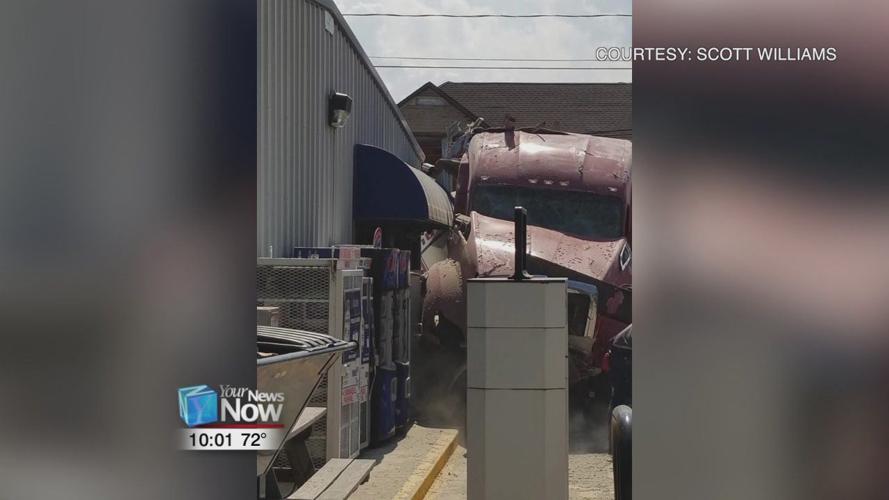 Semi truck drives through a house and crashes into gas station