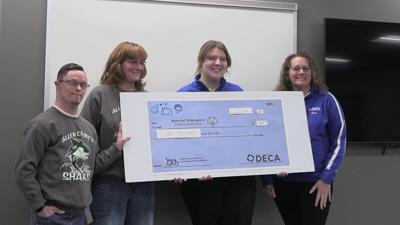 Lima Senior DECA students donate $1,000 to Special Olympics