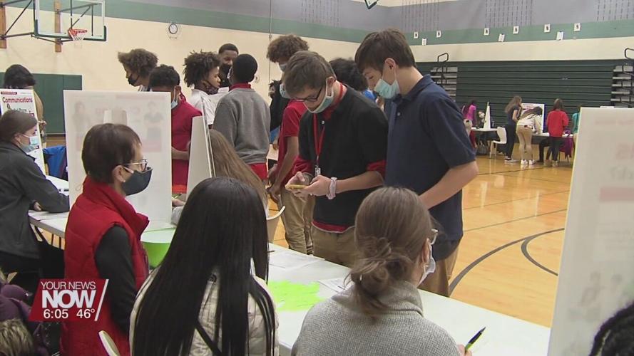 Lima Senior DECA students teaching West Middle School students about financial literacy