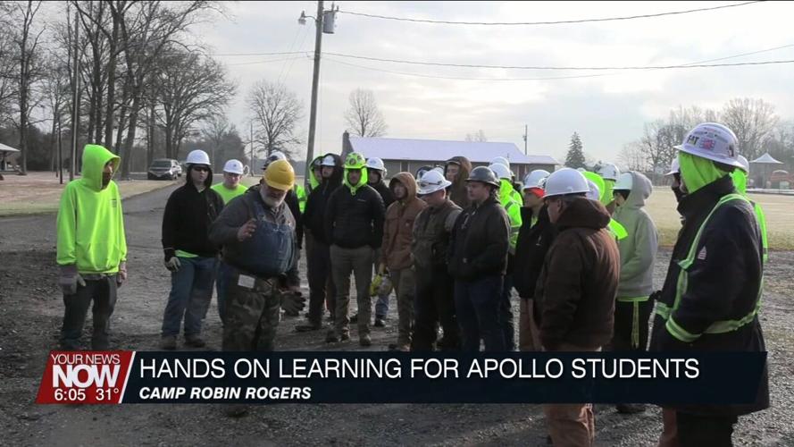 Students from Apollo Career Center take part in cutting down a problematic tree at Camp Robin Rogers