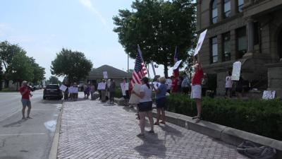 Demonstrators rally outside Auglaize County Courthouse for 'Good Trouble' protest