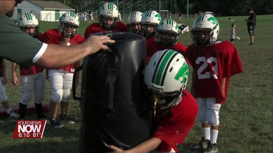 Stay hydrated while playing sports in the heat is important to young athletes