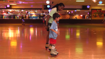 Summer playground program kids roll into fun at skating rink
