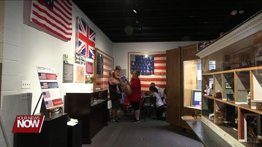 Hancock Historical Museum celebrating Findlay's 50th year with the name "Flag City, USA"
