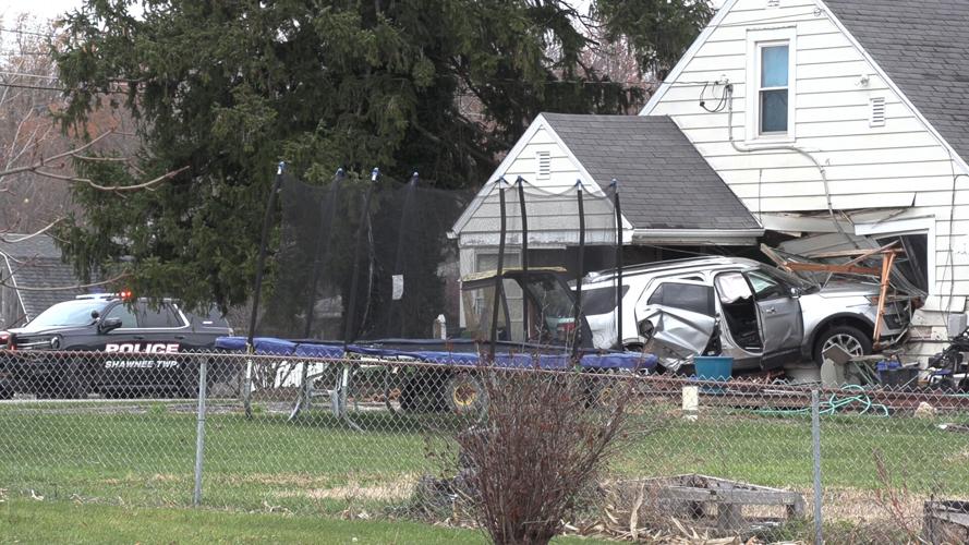 SUV collides into a Shawnee Township home after three-vehicle crash