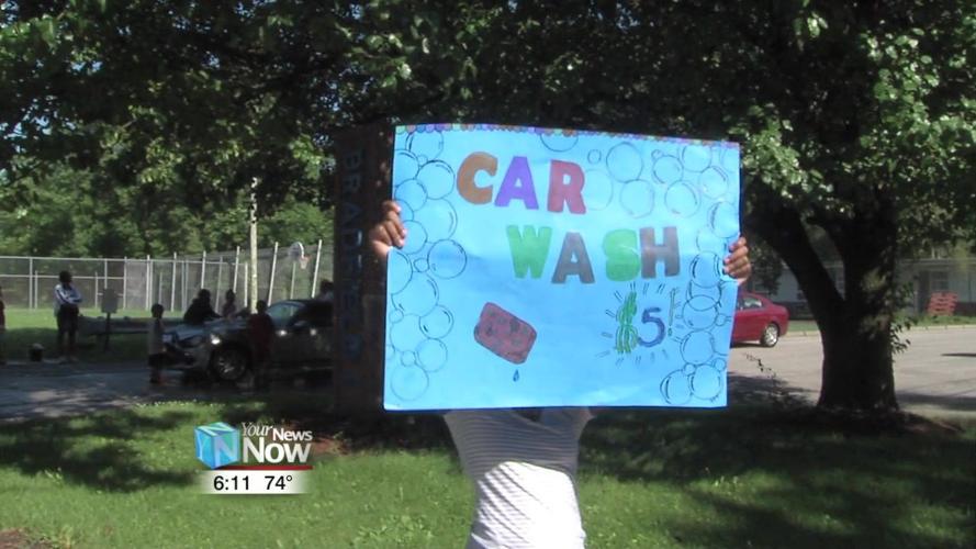 Kids at Bradfield Community Center wash some cars for a fundraiser 1.jpg