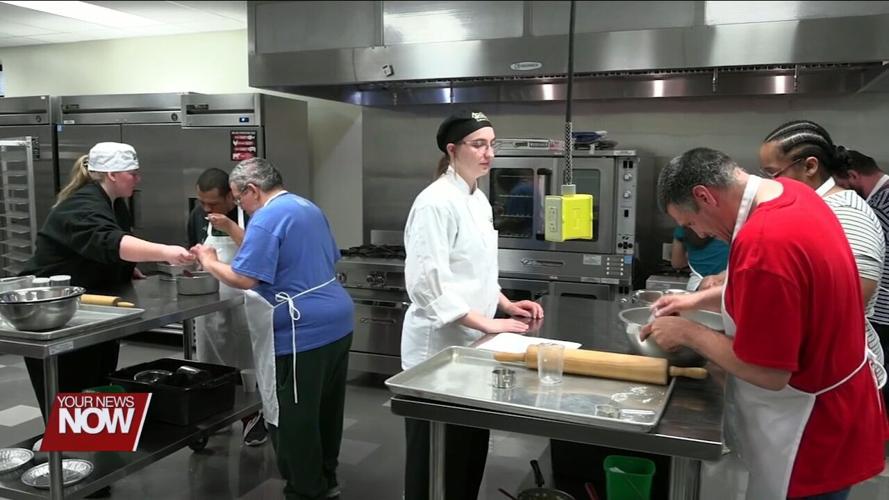 FANS from Allen County Board of DD learn how to make pot pies thanks to Apollo culinary students